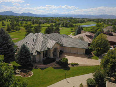 Completed PRQ residential roof with mountain backdrop